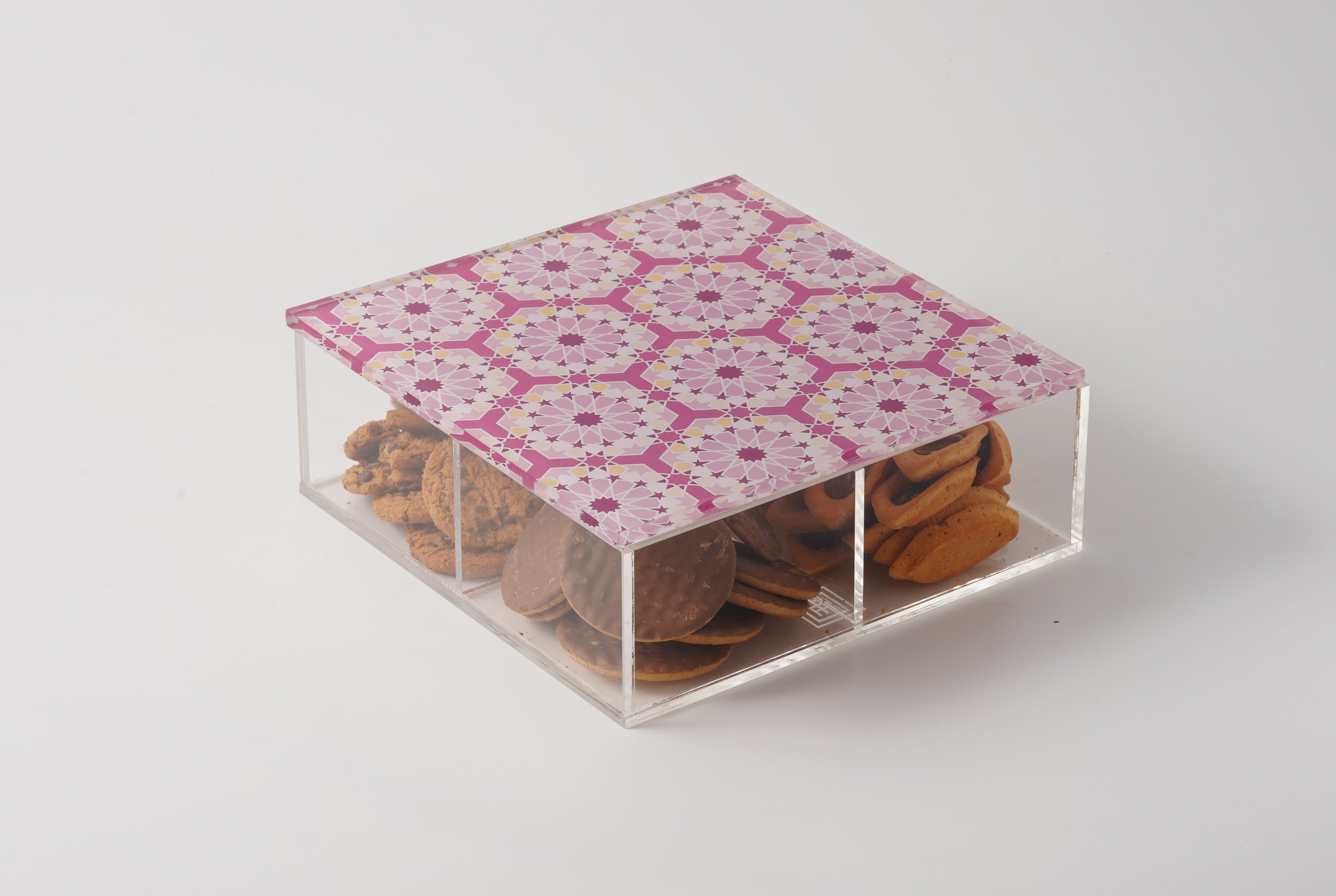 Detail of laser-cut arabesque ornamentation on an acrylic box, made in Dubai by MASHQ