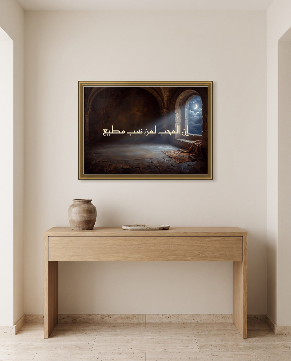 The Lover Obeys the One He Loves: Arabic poetry in Kufic calligraphy, framed in polished gold above an oak console in an entrance hall
