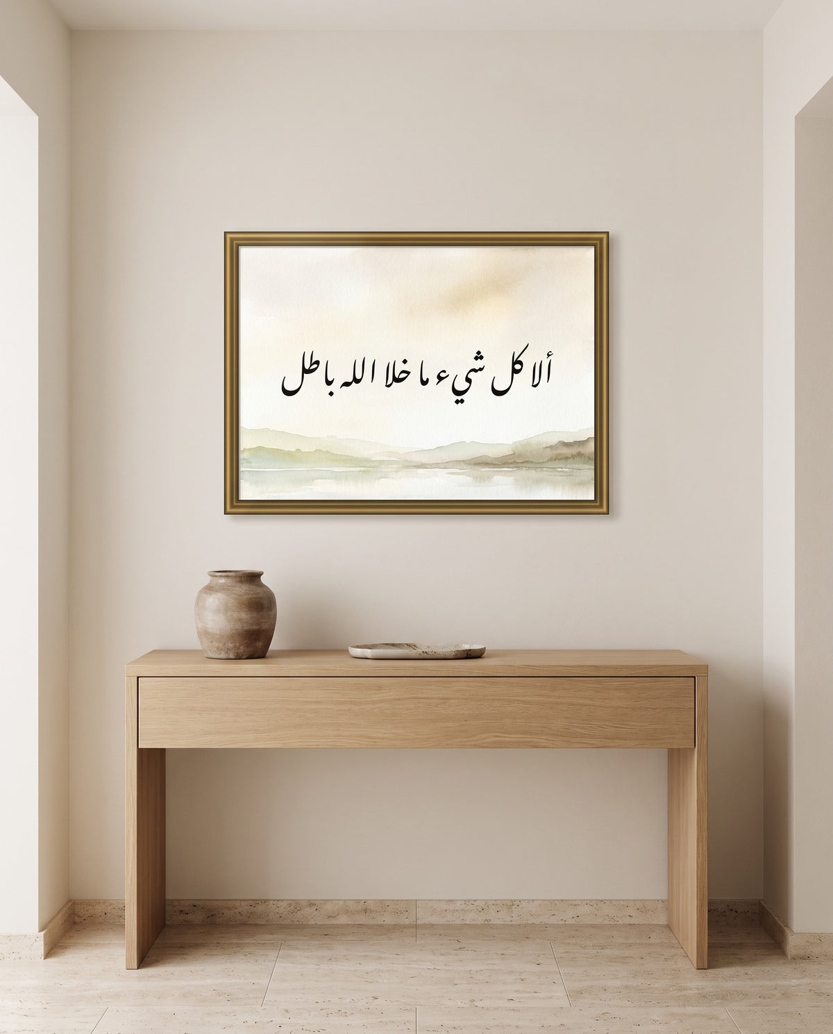 Everything but God Is Passing: Arabic poetry in Nastaliq calligraphy, framed in polished gold above an oak console in an entrance hall