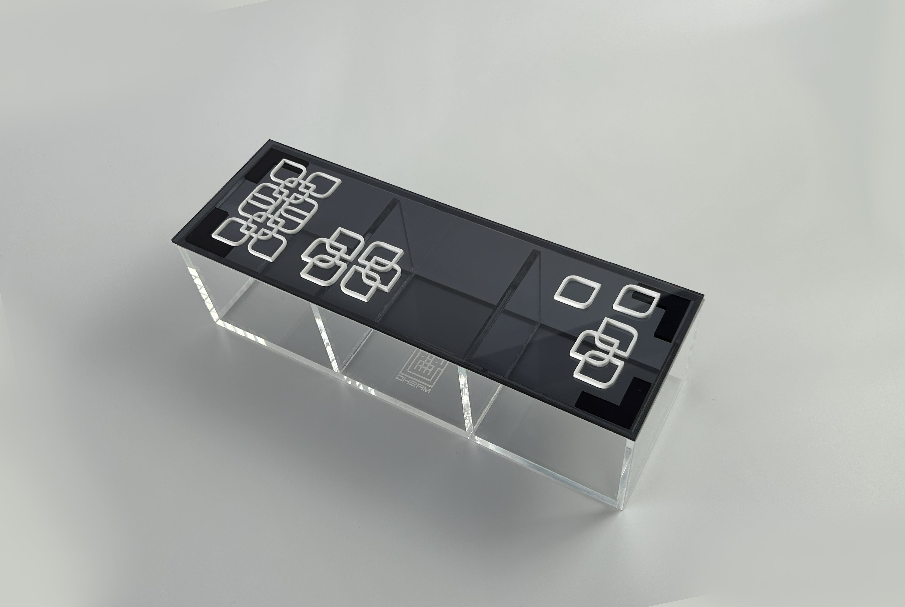 Compact black acrylic box with a white arabesque flower lid for small spaces, by MASHQ Dubai