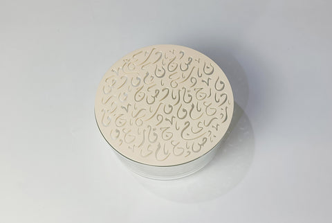 Glass jar topped with Diwani Arabic calligraphy letter lid, made in the UAE by MASHQ